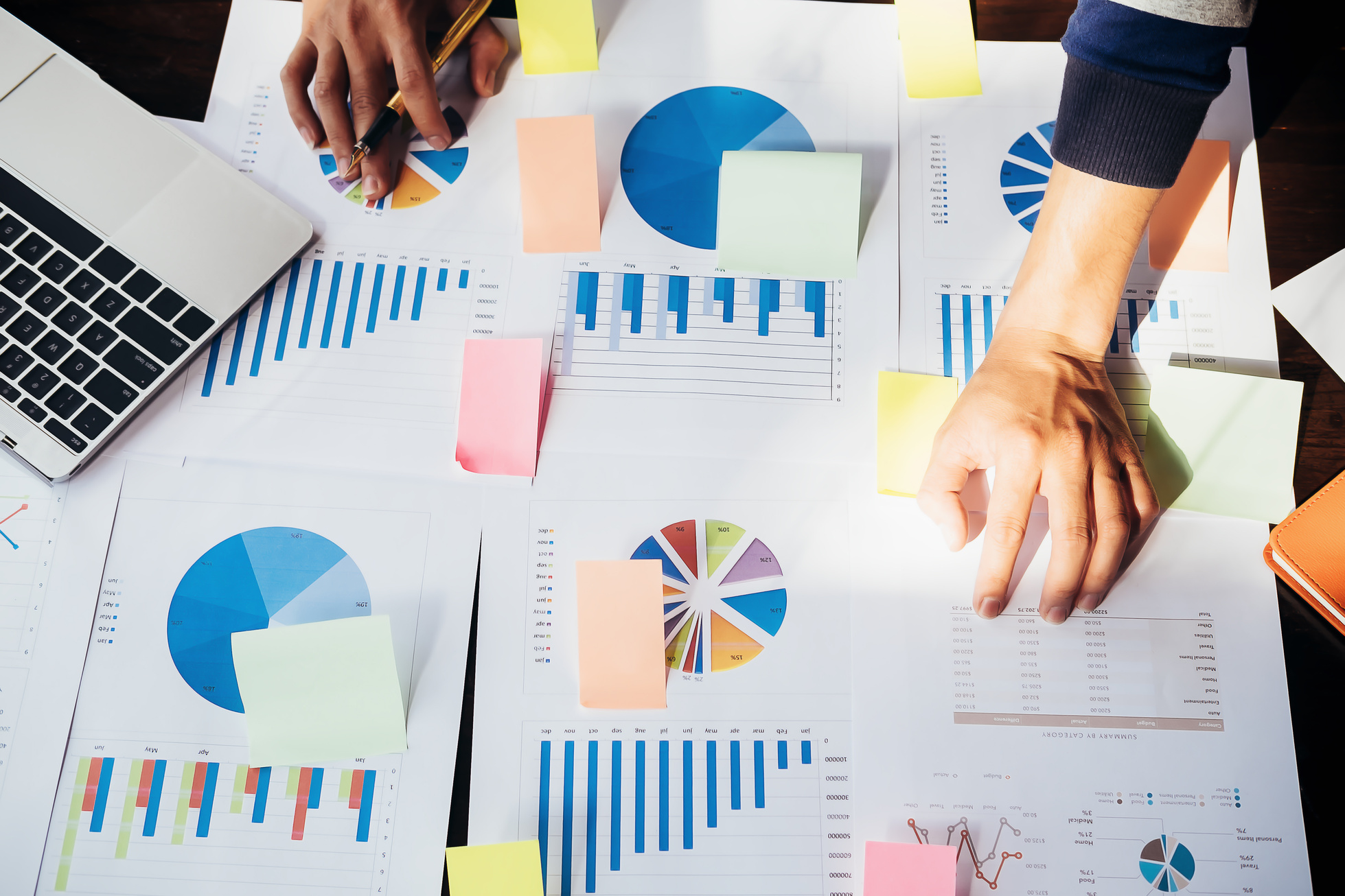 Business People Analyzing Graph Documents of Project